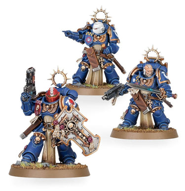Space Marines Bladeguard Veterans tabletop gaming miniatures by Games Workshop, featuring detailed armored soldiers with swords and shields.