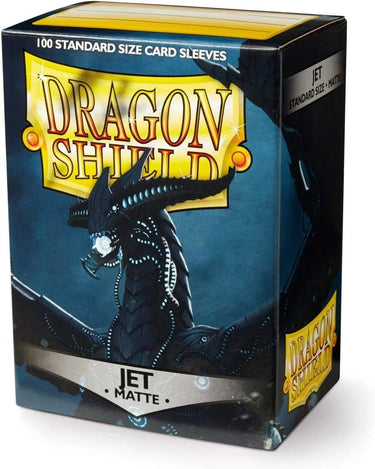 Arcane Tinmen Dragon Shield 100-count standard jet matte card sleeves laid out on a surface.